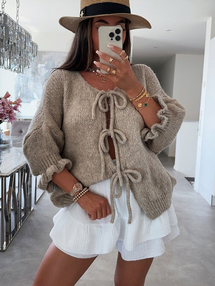 Kvinnors fashionabla cardigan med dekorativ dragsko och luftig passform Mirla-Eva Jonsson