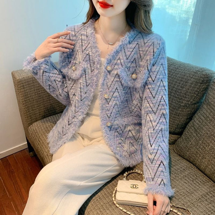 Kvinnors fashionabla kofta med chic zigzag-mönster och eleganta knappdetaljer Mirla-Eva Jonsson
