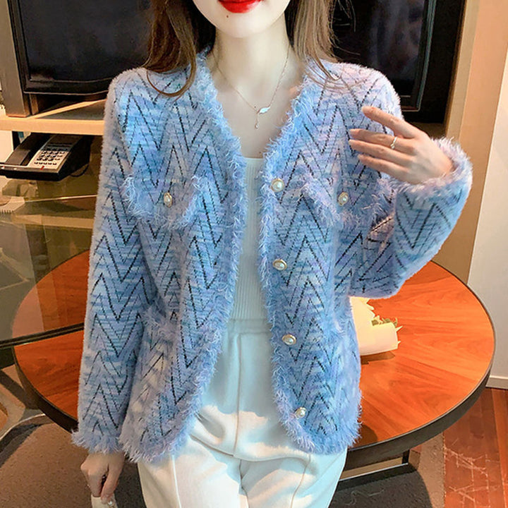 Kvinnors fashionabla kofta med chic zigzag-mönster och eleganta knappdetaljer Mirla-Eva Jonsson