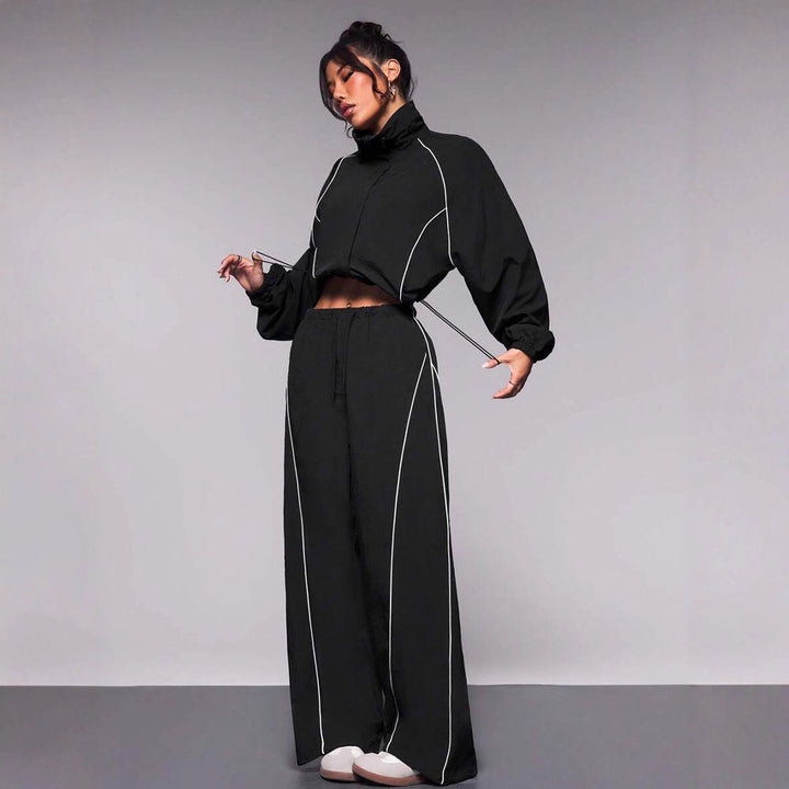 Kvinnors fashionable sportpullover med elastisk midjeband och hög krage Mirla-Eva Jonsson