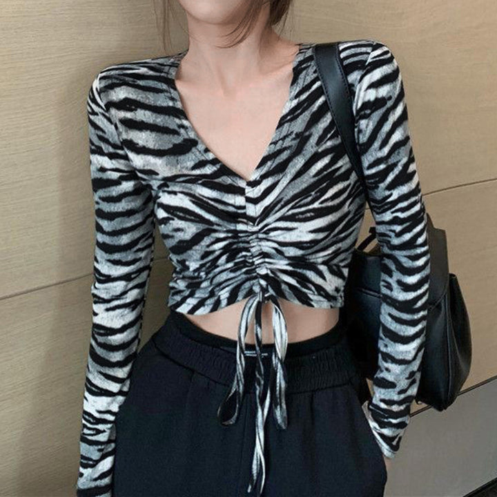 Kvinnors figur-framhämtande crop top med smala långa ärmar Mirla-Eva Jonsson