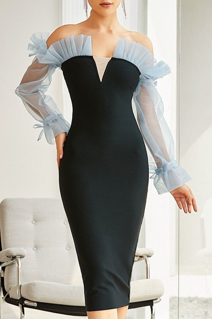 Kvinnors figurnära cocktailklänning med transparenta puffärmar och elegant V-ringning-Eva Jonsson