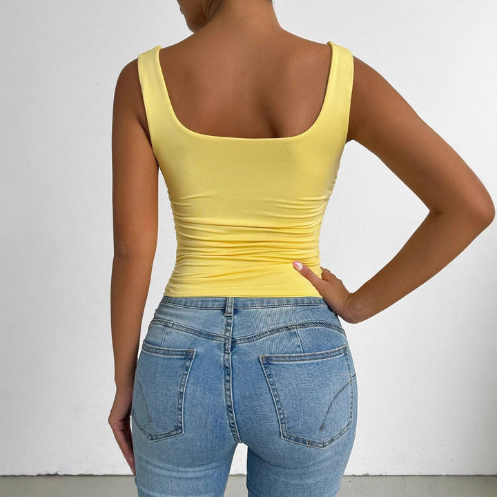 Kvinnors figurnära topp med fyrkantig neckline och volangdetaljer Mirla-Eva Jonsson