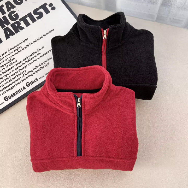 Kvinnors fleecepullover med hög krage och praktiska dragkedjefickor Mirla-Eva Jonsson