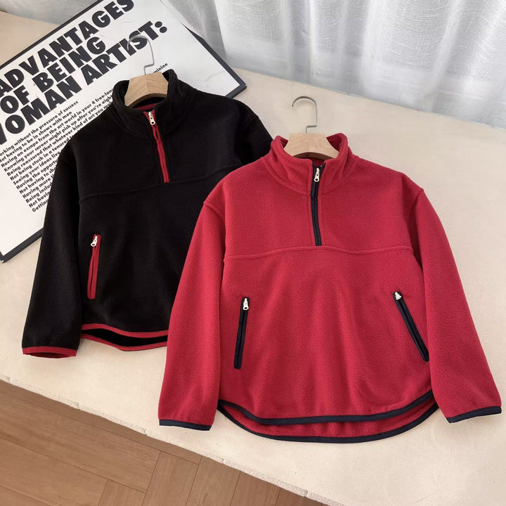 Kvinnors fleecepullover med hög krage och praktiska dragkedjefickor Mirla-Eva Jonsson