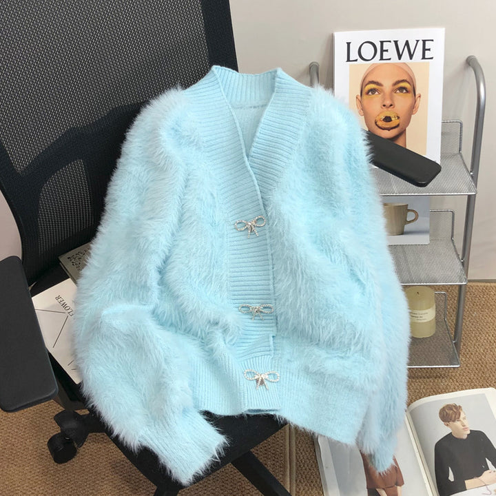 Kvinnors fluffiga cardigan med elegant knappl Decoration Mirla-Eva Jonsson