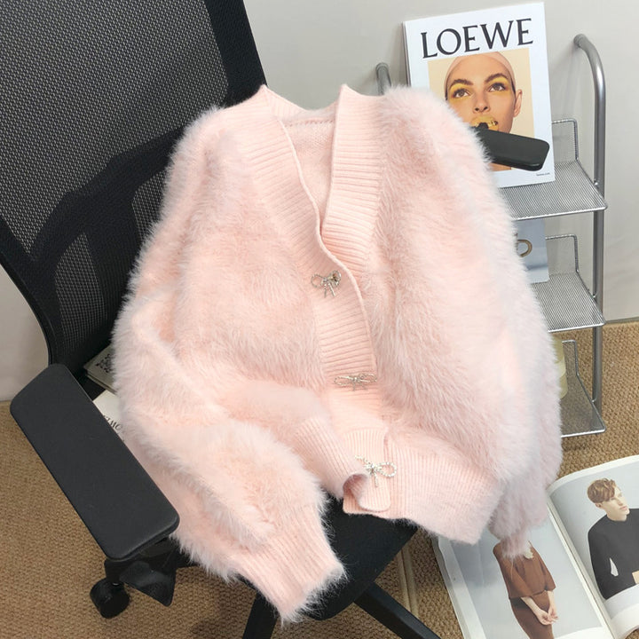 Kvinnors fluffiga cardigan med elegant knappl Decoration Mirla-Eva Jonsson