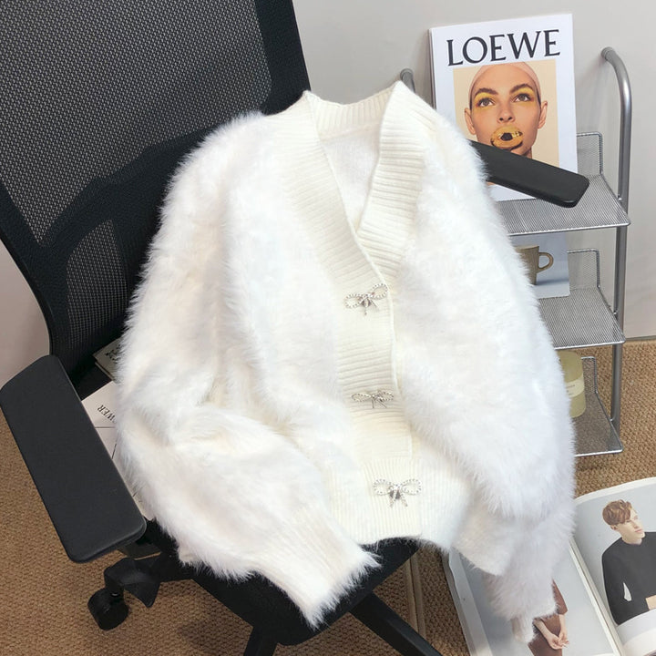 Kvinnors fluffiga cardigan med elegant knappl Decoration Mirla-Eva Jonsson