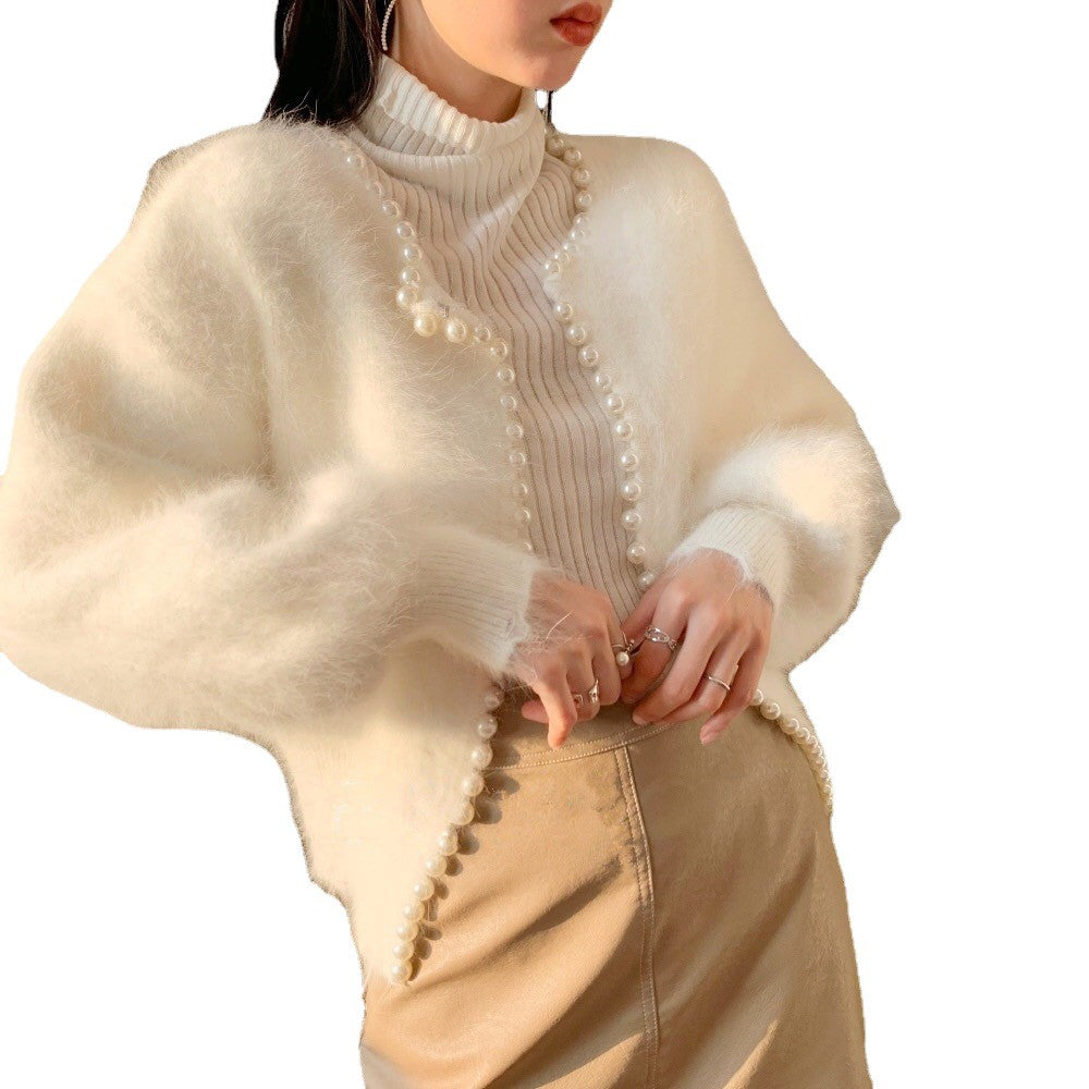 Kvinnors fluffiga cardigan med pärltrim och trendig skärning Mirla-Eva Jonsson