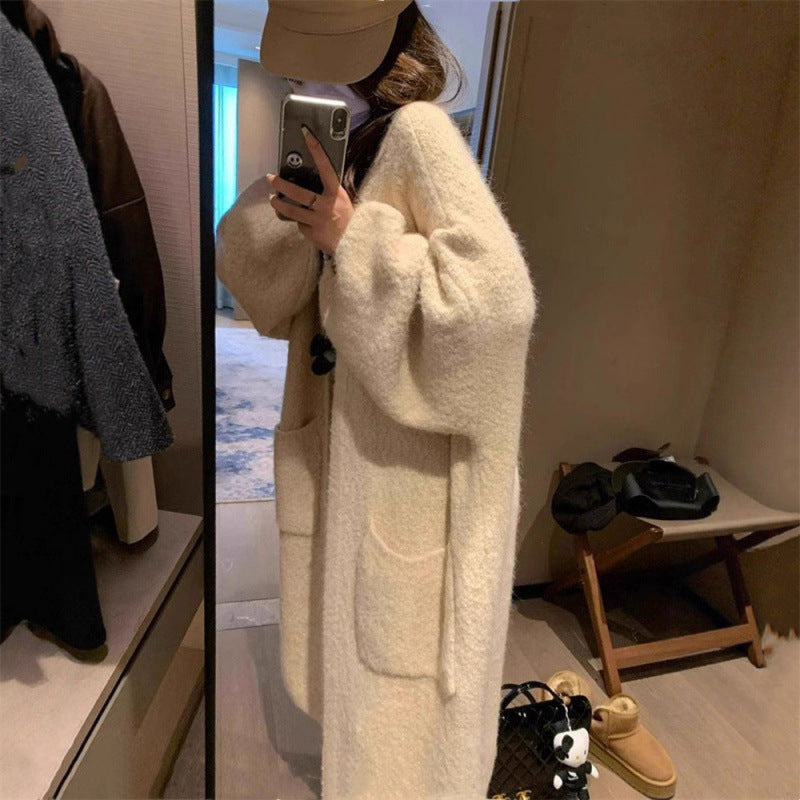 Kvinnors fluffiga cardigan med stora fickor och lös passform Mirla-Eva Jonsson