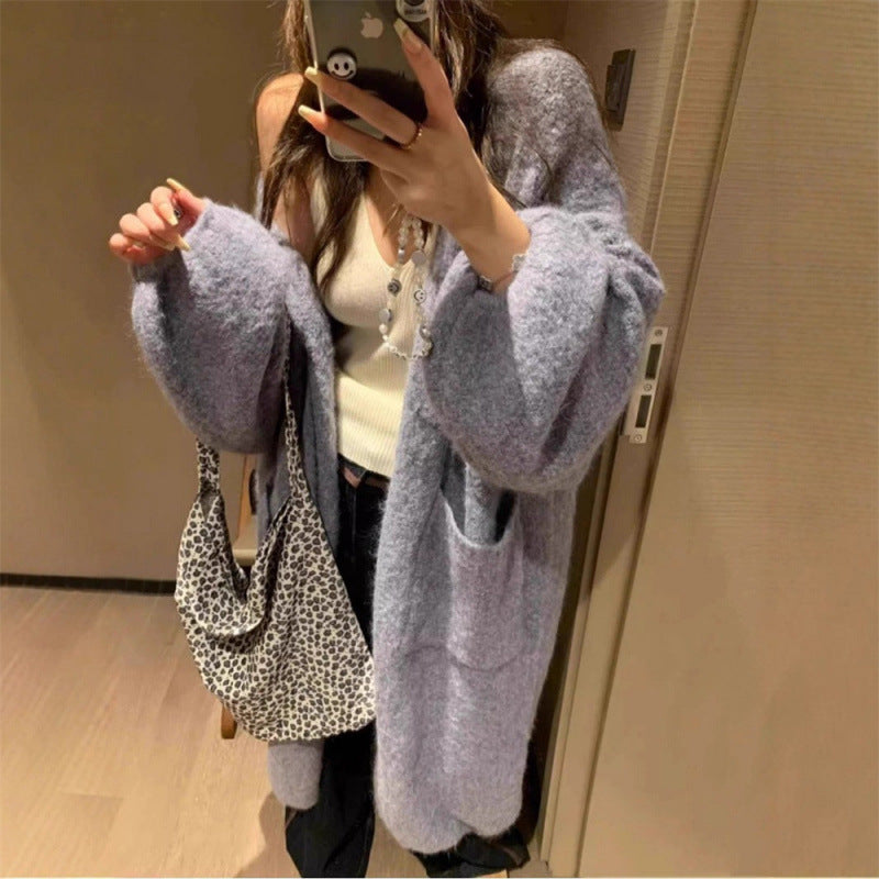 Kvinnors fluffiga cardigan med stora fickor och lös passform Mirla-Eva Jonsson