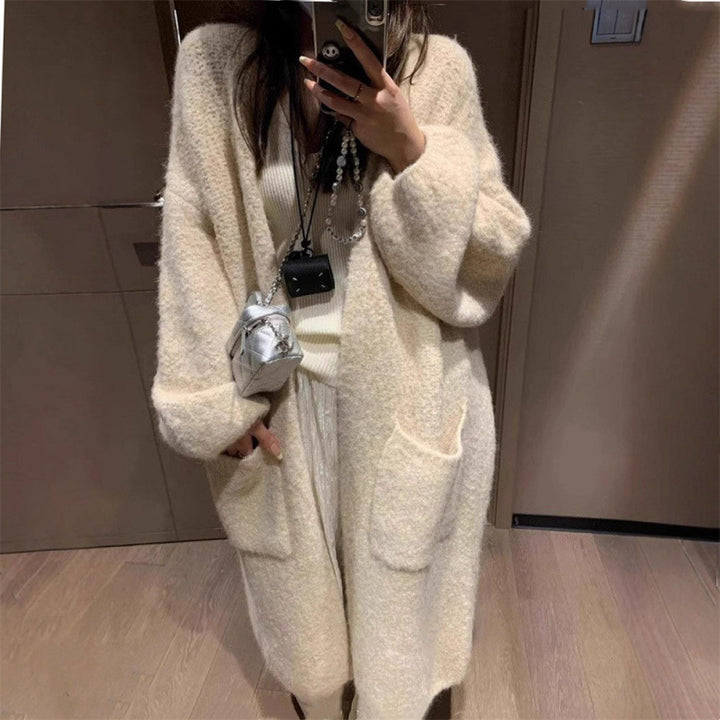 Kvinnors fluffiga cardigan med stora fickor och lös passform Mirla-Eva Jonsson