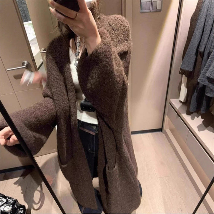 Kvinnors fluffiga cardigan med stora fickor och lös passform Mirla-Eva Jonsson