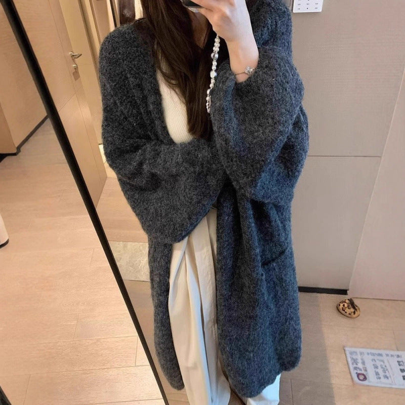 Kvinnors fluffiga cardigan med stora fickor och lös passform Mirla-Eva Jonsson