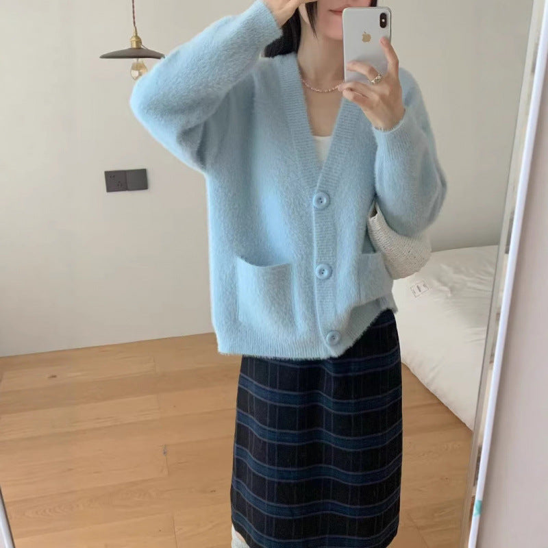 Kvinnors fluffiga knapcardigan med eleganta fickor Mirla-Eva Jonsson