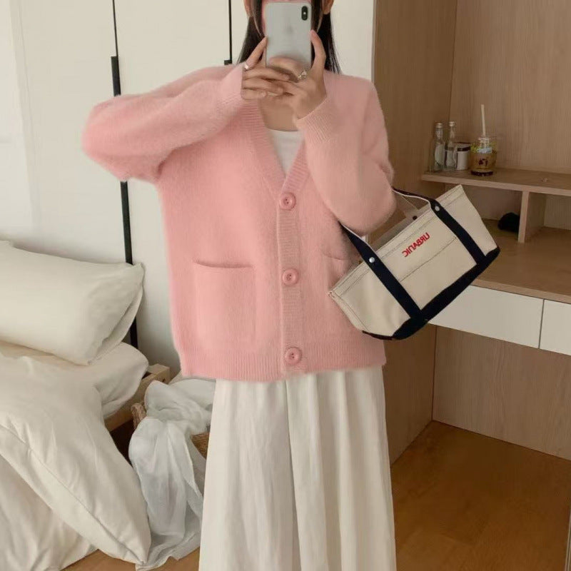 Kvinnors fluffiga knapcardigan med eleganta fickor Mirla-Eva Jonsson