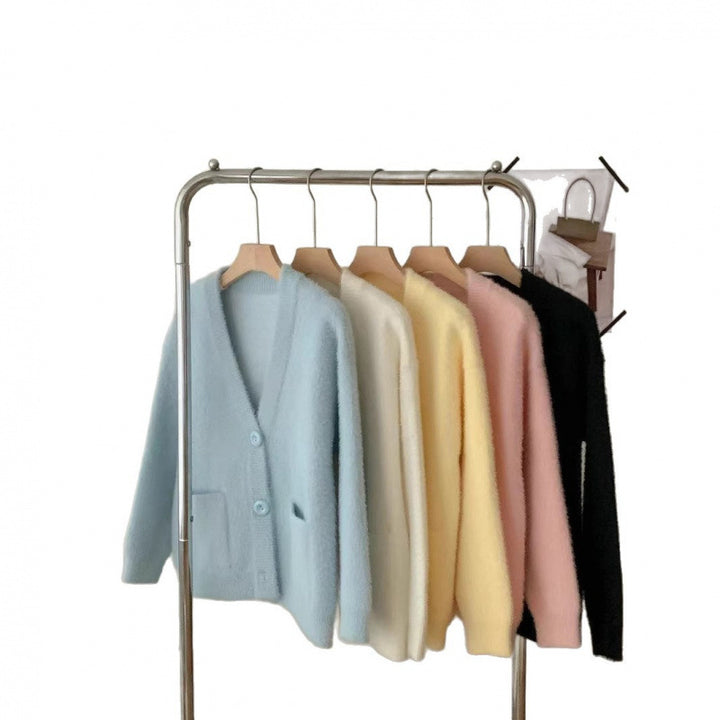 Kvinnors fluffiga knapcardigan med eleganta fickor Mirla-Eva Jonsson