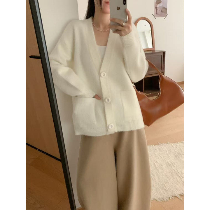 Kvinnors fluffiga knapcardigan med eleganta fickor Mirla-Eva Jonsson