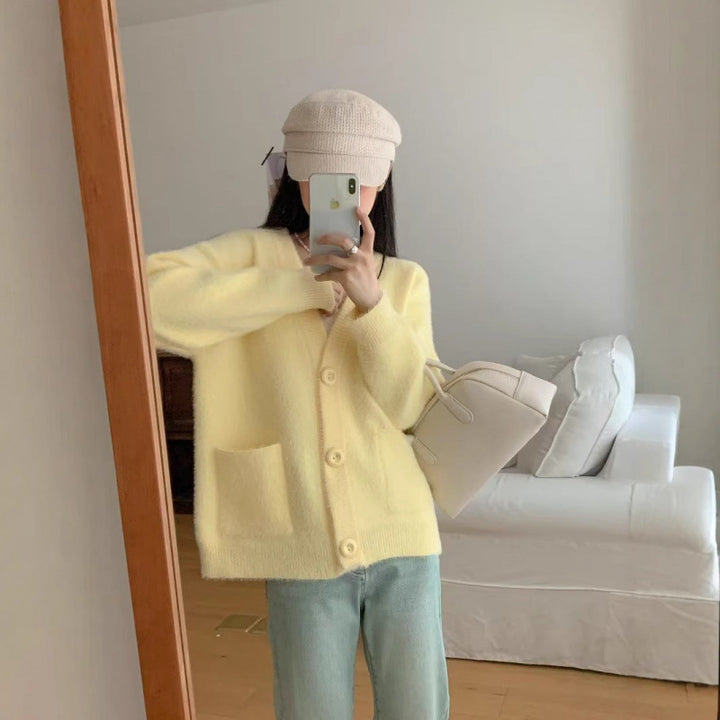 Kvinnors fluffiga knapcardigan med eleganta fickor Mirla-Eva Jonsson
