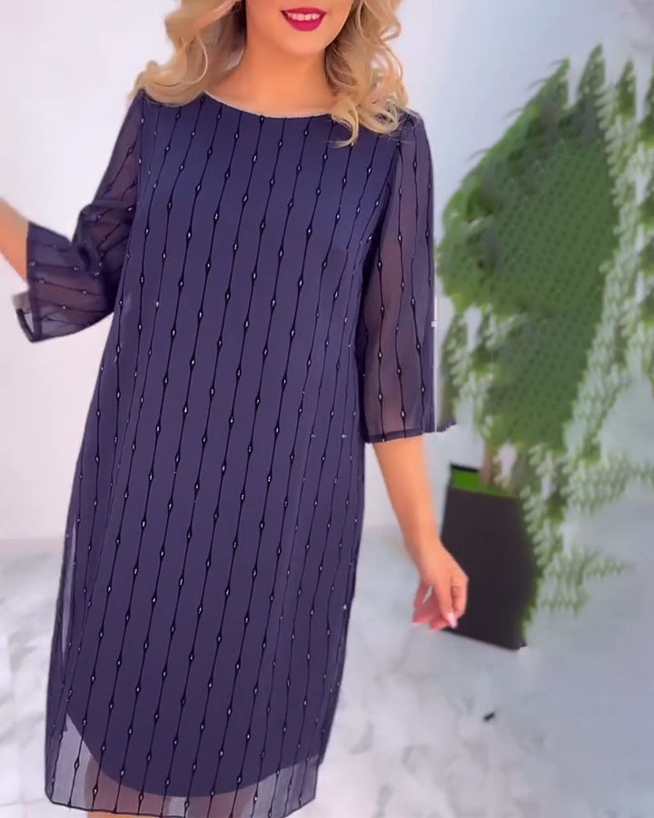 Kvinnors gala klänning med transparenta ärmar och subtila pärldetaljer Mirla-Eva Jonsson