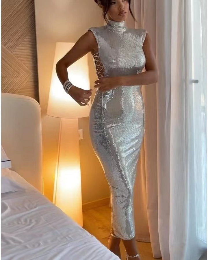 Kvinnors glamorösa kvällsklänning med glittrande paljettmönster och figurnära skärning-Eva Jonsson
