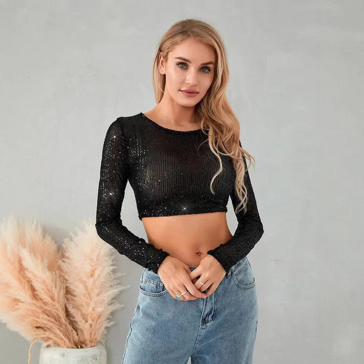 Kvinnors glittrande crop top med långa ärmar och figurnära snitt-Eva Jonsson