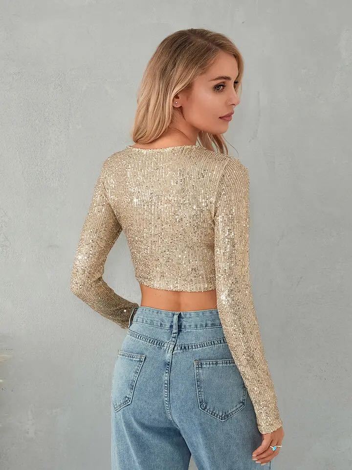 Kvinnors glittrande crop top med långa ärmar och figurnära snitt-Eva Jonsson