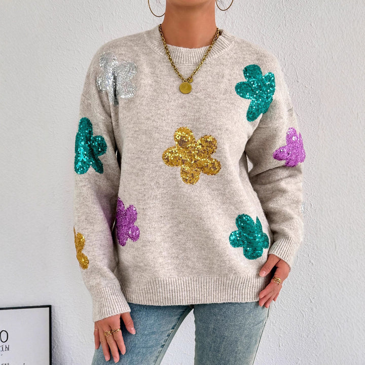 Kvinnors glittrande oversized tröja med blommotiv Mirla-Eva Jonsson