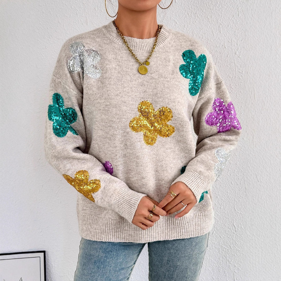 Kvinnors glittrande oversized tröja med blommotiv Mirla-Eva Jonsson