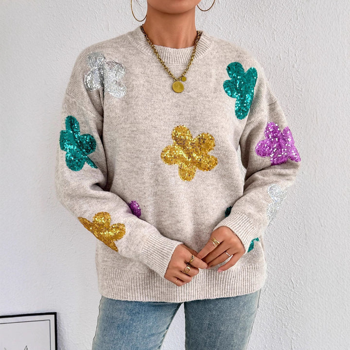 Kvinnors glittrande oversized tröja med blommotiv Mirla-Eva Jonsson