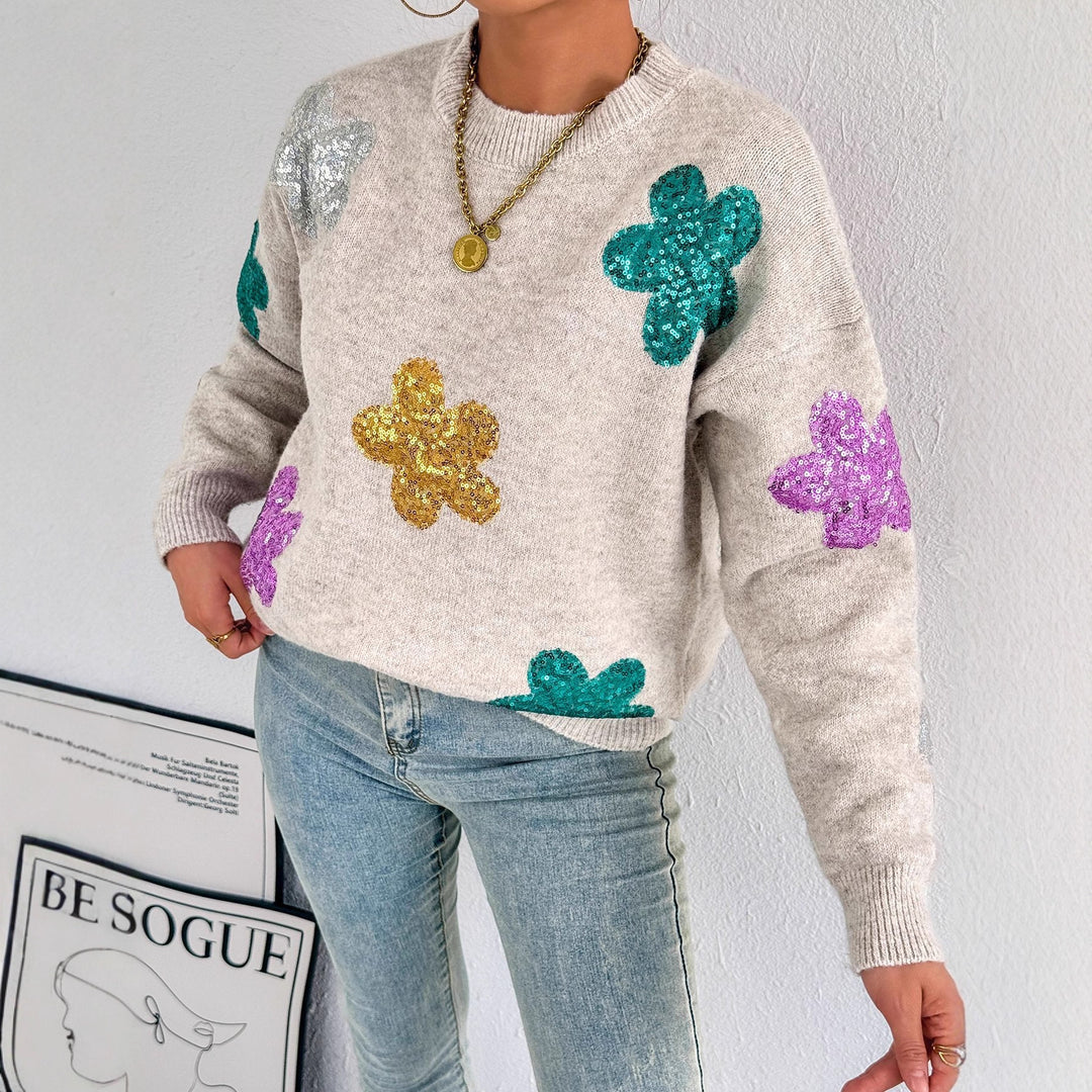 Kvinnors glittrande oversized tröja med blommotiv Mirla-Eva Jonsson