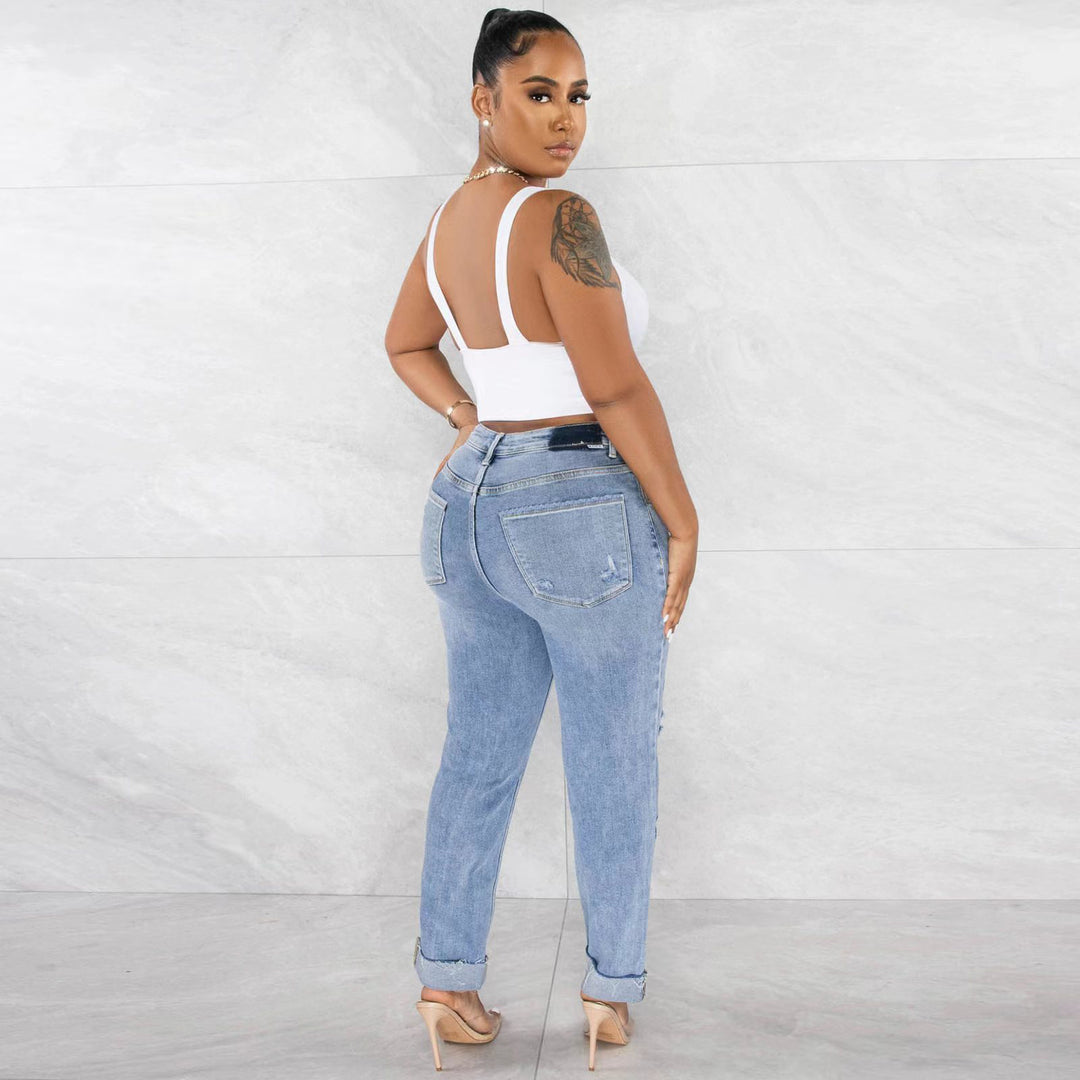 Kvinnors högmidjade boyfriend jeans med fransad fåll och avslappnad använd look Mirla-Eva Jonsson
