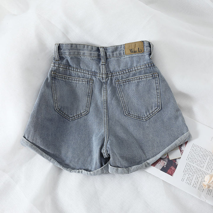 Kvinnors högmidjade denimshorts med konvertibel fåll och elastisk midja Mirla-Eva Jonsson