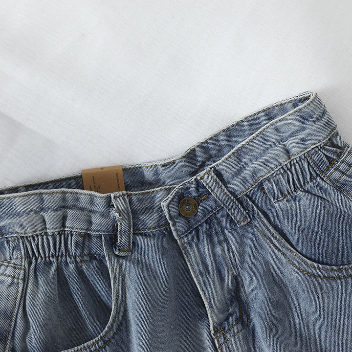 Kvinnors högmidjade denimshorts med konvertibel fåll och elastisk midja Mirla-Eva Jonsson