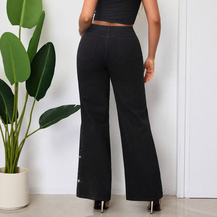 Kvinnors högmidjade jeans med glittrande rhinestones och bred passform Mirla-Eva Jonsson