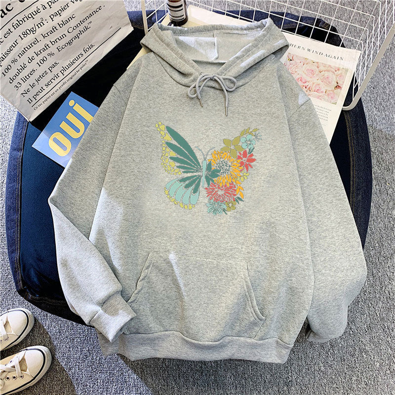 Kvinnors hoodie med blommigt fjärilsdesign Mirla-Eva Jonsson