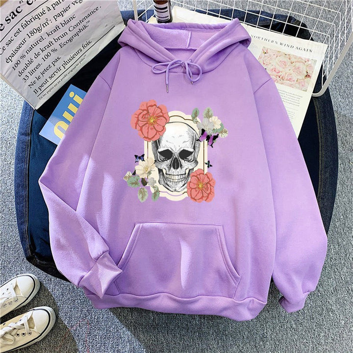 Kvinnors hoodie med detaljerad skalledesign och blommönster Mirla-Eva Jonsson