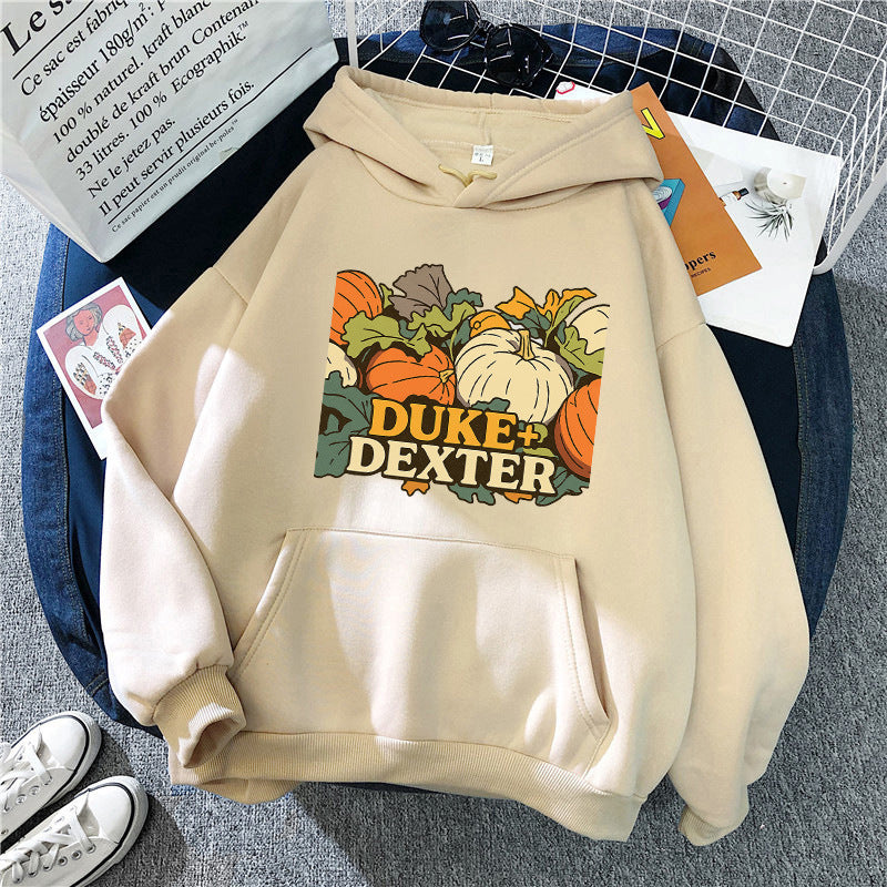 Kvinnors hoodie med glad pumpamotif Mirla-Eva Jonsson