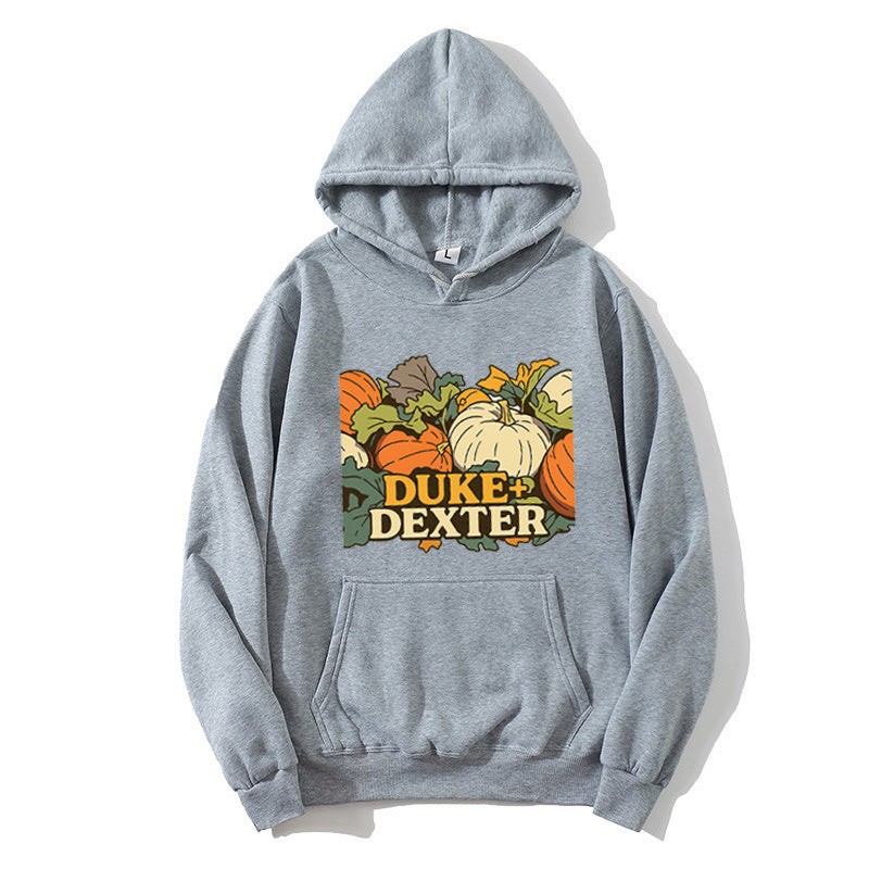 Kvinnors hoodie med glad pumpamotif Mirla-Eva Jonsson