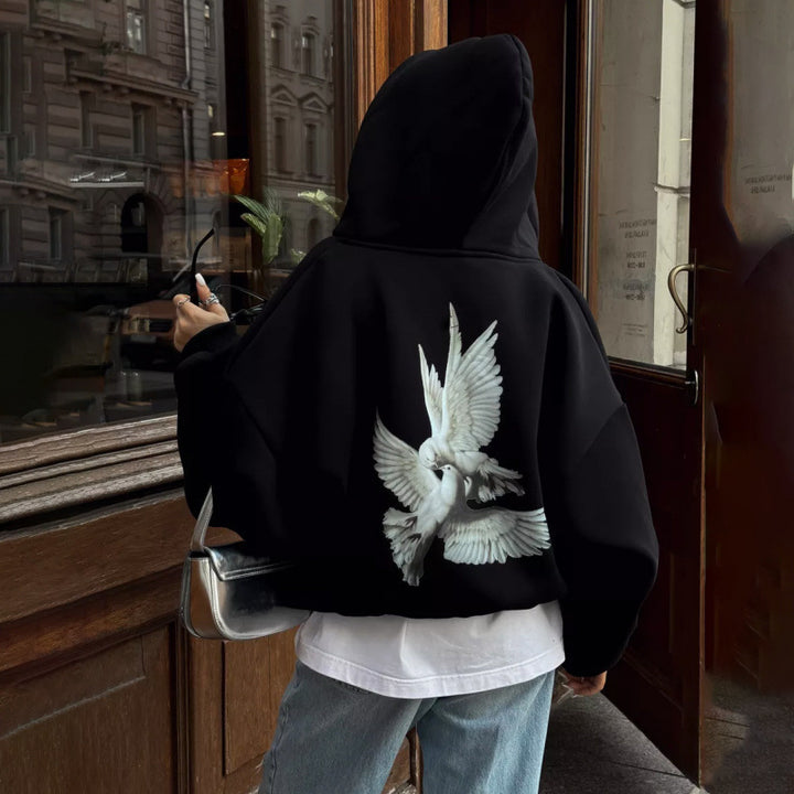 Kvinnors hoodie med konstnärlig fågeldesign och avslappnad passform Mirla-Eva Jonsson