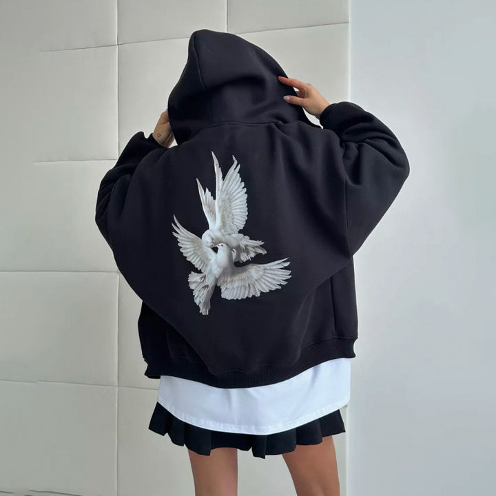 Kvinnors hoodie med konstnärlig fågeldesign och avslappnad passform Mirla-Eva Jonsson