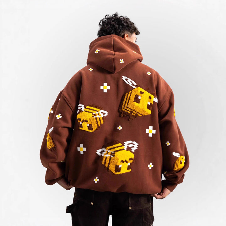 Kvinnors hoodie med kreativt bihuvud och bekväm passform Mirla-Eva Jonsson