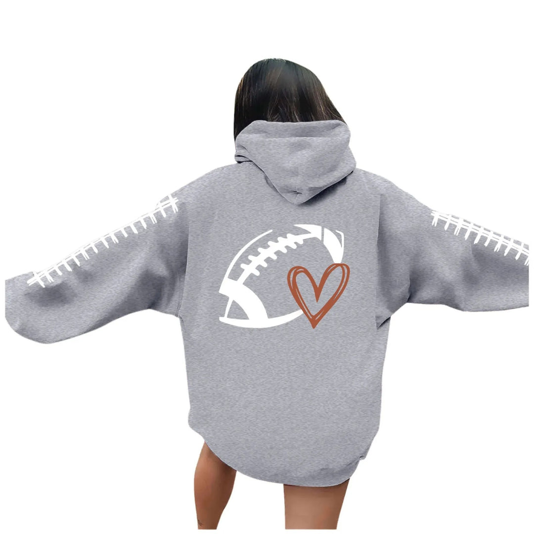 Kvinnors hoodie med kreativt fotbollsmotiv och avslappnad passform Mirla-Eva Jonsson