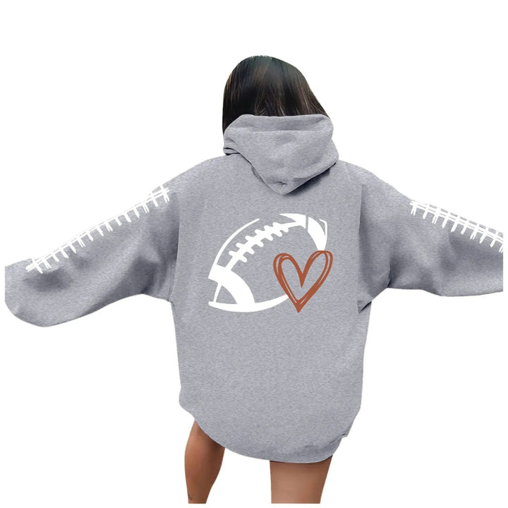 Kvinnors hoodie med kreativt fotbollsmotiv och avslappnad passform Mirla-Eva Jonsson