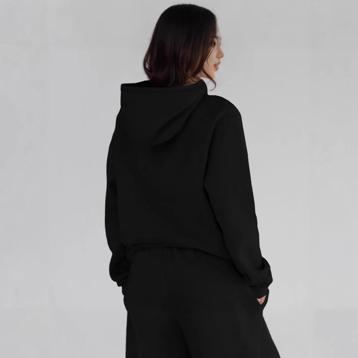 Kvinnors hoodie med kreativt tryck och bekväm passform Mirla-Eva Jonsson