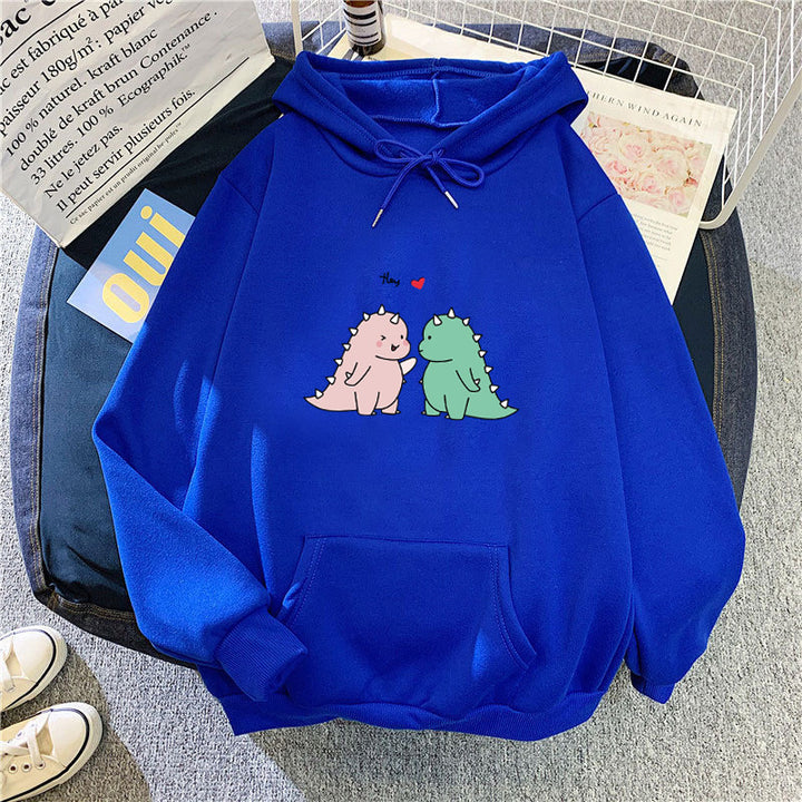 Kvinnors hoodie med lekfullt dinosaurmotiv Mirla-Eva Jonsson