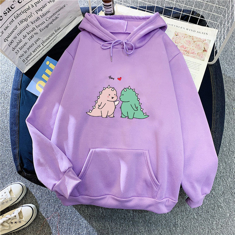 Kvinnors hoodie med lekfullt dinosaurmotiv Mirla-Eva Jonsson