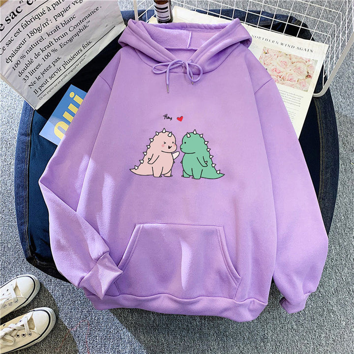 Kvinnors hoodie med lekfullt dinosaurmotiv Mirla-Eva Jonsson