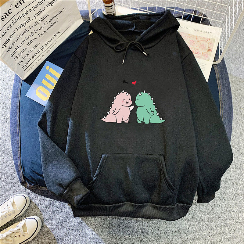 Kvinnors hoodie med lekfullt dinosaurmotiv Mirla-Eva Jonsson