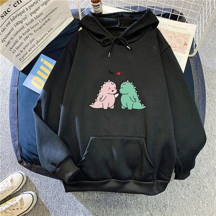 Kvinnors hoodie med lekfullt dinosaurmotiv Mirla-Eva Jonsson